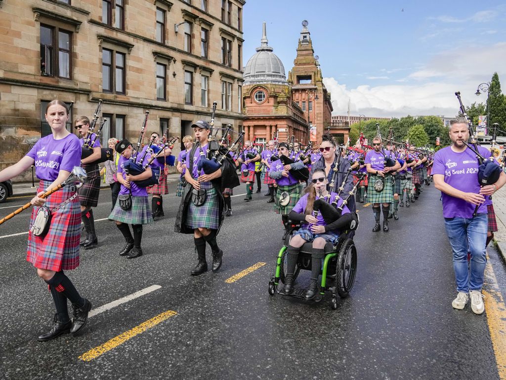 Record breaking parade of pipers gets the biggest week of bagpipes underway